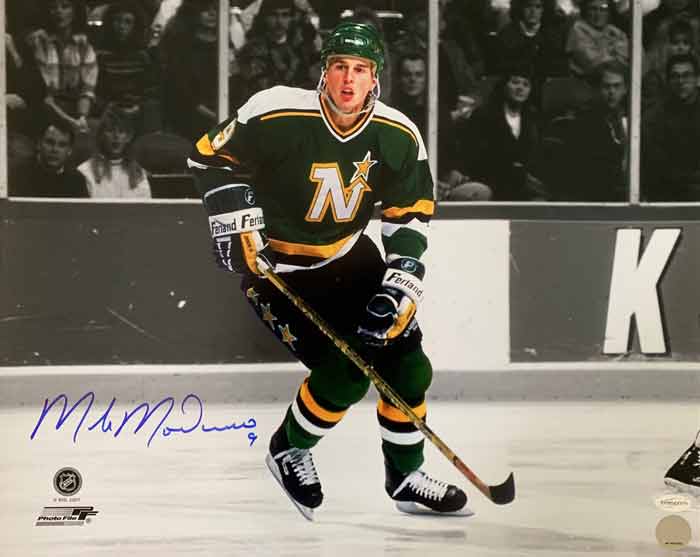 Mike Modano Signed Skating with Stick Spotlight Horizontal 8x10 Photo